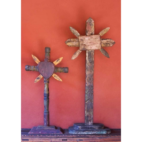 Mexico Two wooden crosses against red wall